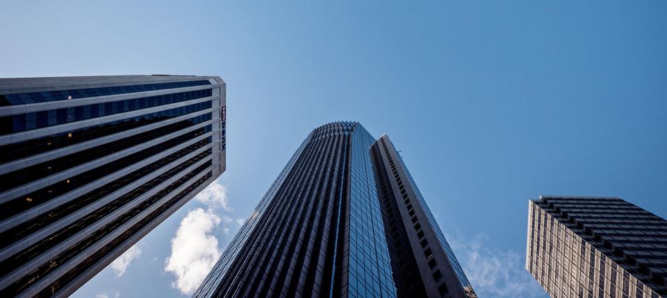 Low angle view of tall office buildings and blue sky in downtown San Francisco
