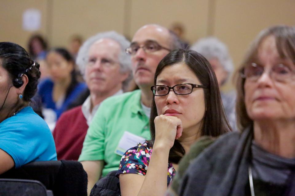 Attendees at the special forum listen to the presentation.