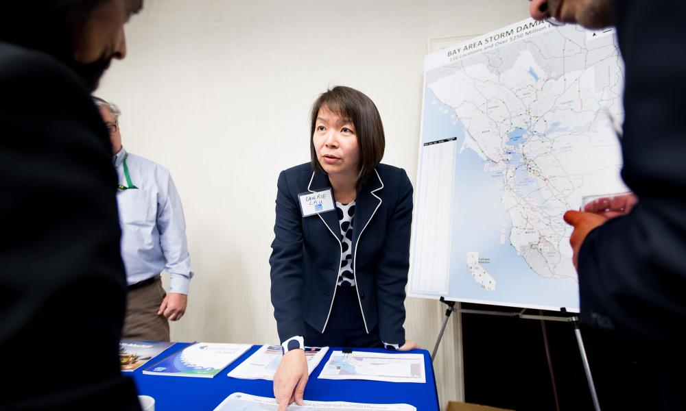 Caltrans representative Laurie Lau teaches the public about transportation initiatives at the Plan Bay Area 2040 open house in Walnut Creek.