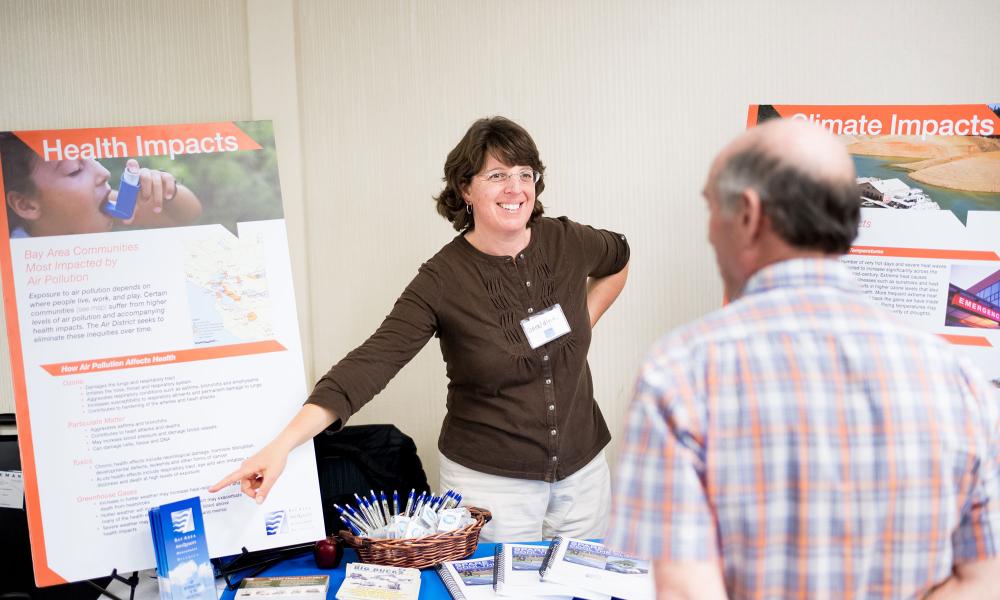 Geraldina Grunbaum, environmental planner for the Bay Area Air Quality Management District, talks to the public at the Plan Bay Area 2040 open house in Walnut Creek.